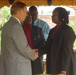 Priscilla Sithole from Amakhosi collects their exit package from Swedish Ambassador 