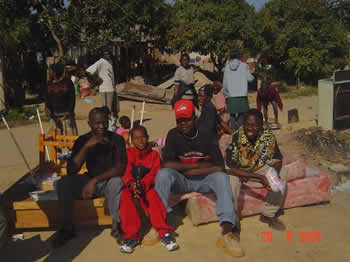 Pondering the next move. A Chitungwiza family.