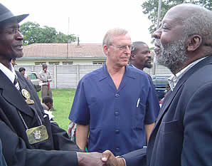 SAHRIT Chairperson Professor Walter Kamba (right) greets Headman Zihute (left).