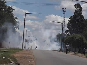Riot police throw tear gas in Highfield streets