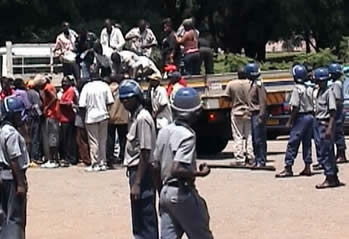 Activists arrive at Rotten Row Magistrates Court in an open backed truck