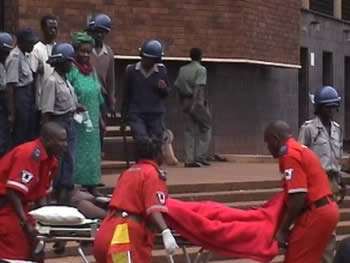 Ambulance staff assist activists who are too injured to walk
