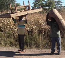 Poor urban dwellers scramble to save their belongings from police raids on their homes