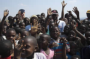 Volunteer students from Gateway High School in Harare having fun with children from the Goromonzi community
