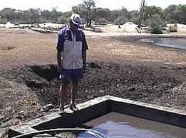 Johnny Rodrigues pumps fresh water into a trough at Hwange National Park