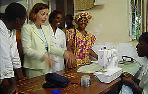 Canadian ambassador Roxanne Dubé speaking to one of the students atDzidzai Women's Technical College