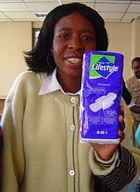 Shingirirai Rimayi, ZCTU North Eastern Region Treasurer holds one of the pads donated to Zimbabwe