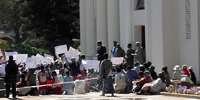 Bulawayo Mayor, Japhet Ndabeni Ncube addresses members of WOZA outsite the City Hall
